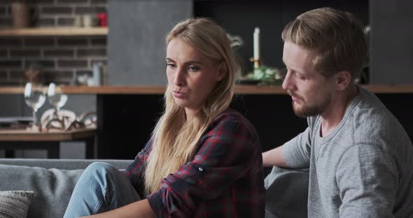 Face of Upset Blonde Lady Crying with Negative Emotions Pleasant Male Embrace with Support Close Up alt