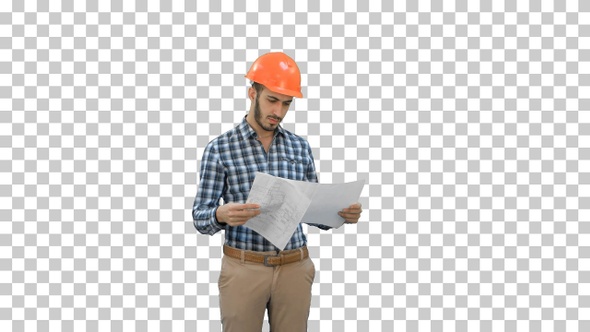 Engineer in hardhat looking at construction plan, Alpha Channel