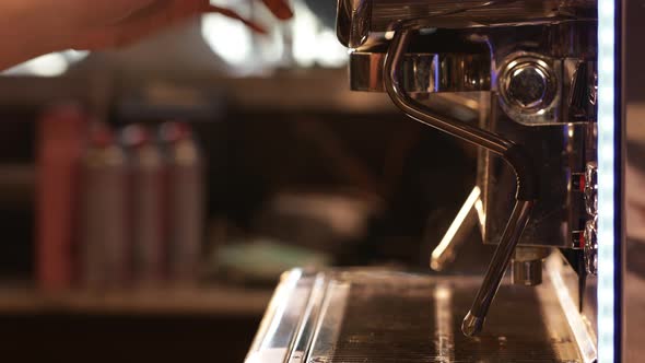 Flow of steam from professional espresso coffee machine in the cafe. Small business concept alt