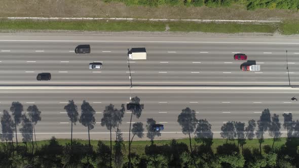 Top down aerial shot summer road with lots of cars with cars in forest 03 alt