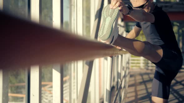 Athlete Stretching Before Running Outdoors.Stretching Before Morning Jogging.Warming Up Muscle Man. alt