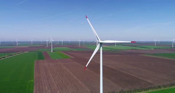 Aerial view of a wind turbine. Windmill for electric power production. Green energy. alt