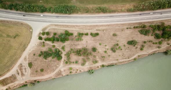 Aerial Flight Over the Road Between Fields. Autumn Colors. alt