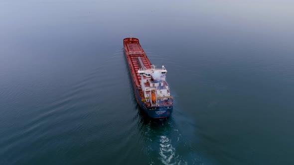 4K aerial footage of a self discharging bulk carrier ship sailing the St Lawrence River.