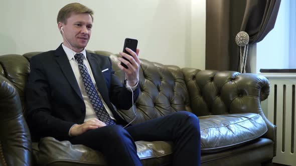 Online Video Chat on Smartphone By Businessman alt