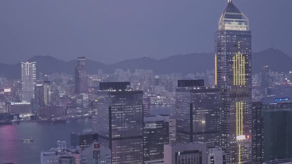 Central Plaza skyscraper in the Hong Kong city skyline at night. Aerial drone view alt