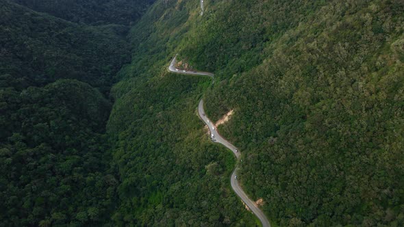 Serpantine Road in Mountain Gorge with Green Forest