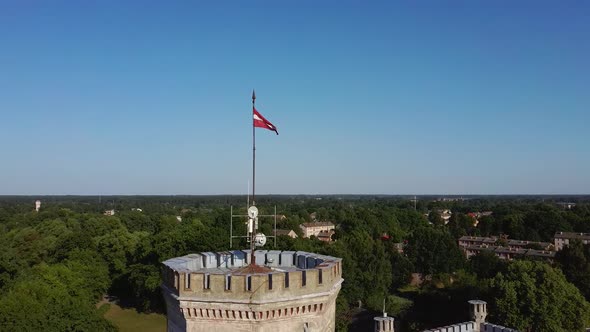 Vecauce Castle Tower With a Flying Latvian Flag. View From Above.  alt