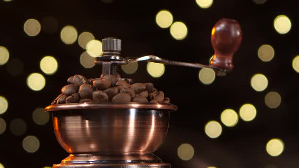 Coffee Mill Filled with Roasted Coffee Beans. Closeup. Studio alt