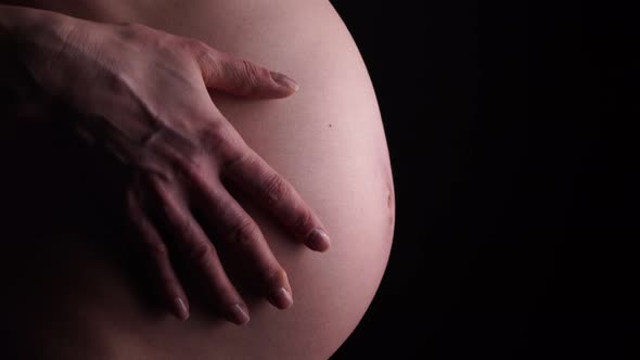 Pregnant Woman Caressing her Belly