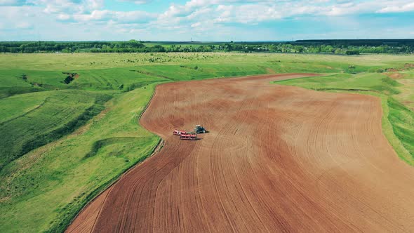 Process of Plowing on a Farmland alt