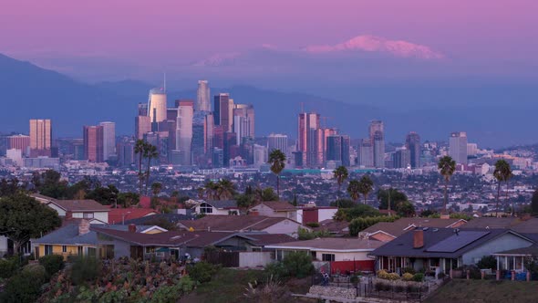 Downtown Los Angeles Skyline and Snowy Mount Baldy Mountain Sunset alt