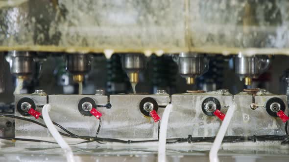 A large industrial punch press forming sheet metal parts alt