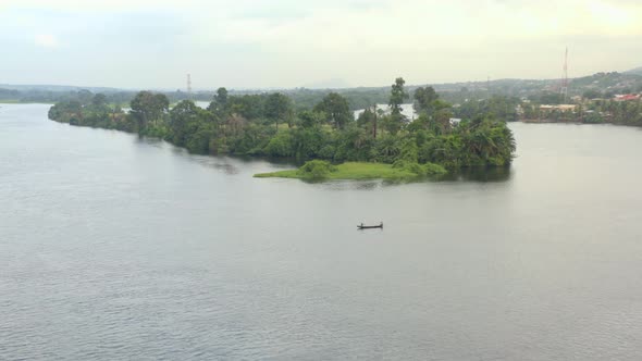 Island on the Volta river in Ghana with canoe or boat alt