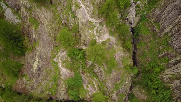 drone view of a mountain trail, people are walking in the nature. swiss alps, aerial. alt