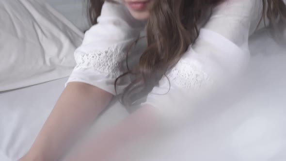 Graceful Woman Lying Down on Bed alt