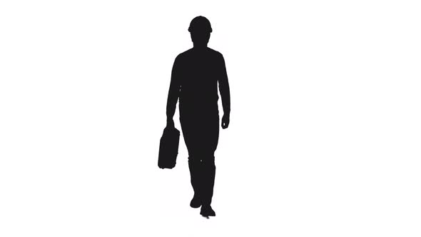 Silhouette Of Builder In Hard Hat With Suitcase Walking Slowly