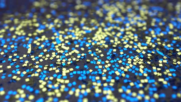 Rotation Yellow And Blue Glitter On The Background