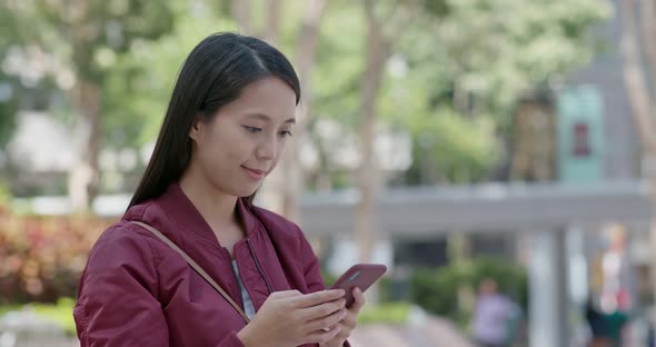 Young woman look at mobile phone alt