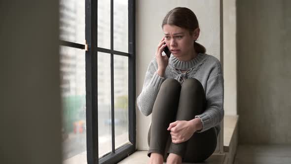 A young woman gets upset and angry when she hears bad news alt