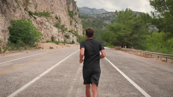 Fit young man running fast alt