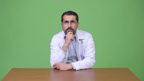 Handsome Persian Bearded Man Doctor Thinking