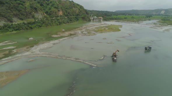 Cleaning and Deepening By a Dredger on the River. Philippines, Luzon alt