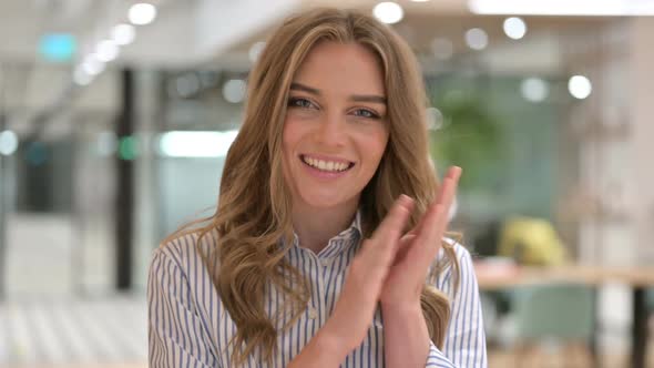 Portrait of Excited Businesswoman Clapping Applauding alt