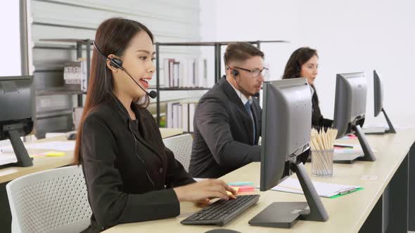 Business People Wearing Headset Working in Office alt