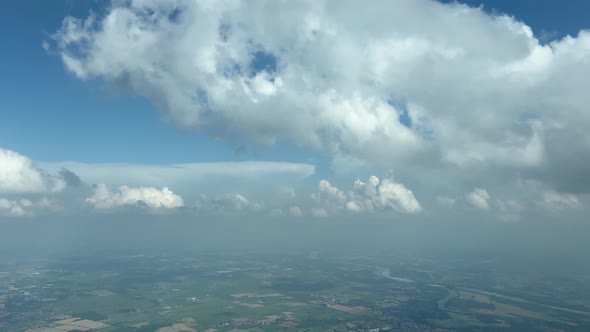 Aerial cockpit view, pilot pov, from a jet cockpit during a left turn near Milan (Italy) airport, wi alt