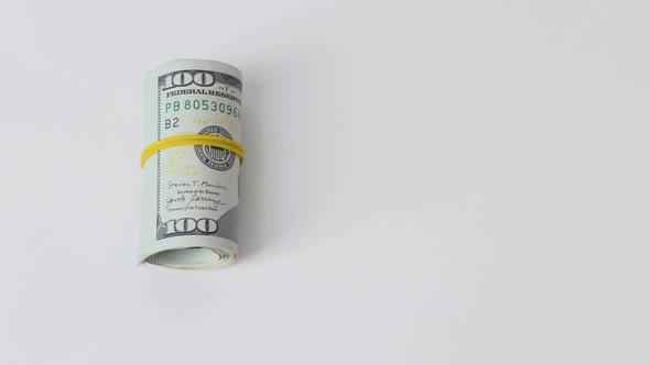 A Roll of Dollar Bills White Powder in a Transparent Bag