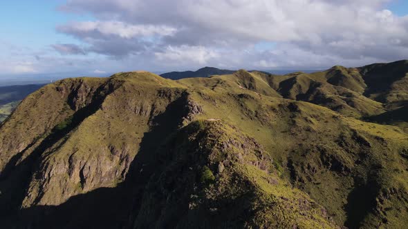 Clockwise aerial orbit around Cerro Pelado while slowly descending. Beautiful clouds above a stunnin alt