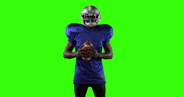 African American football player on green screen background. alt