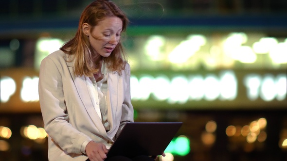 Attractive young businesswoman wearing a suit is video alt