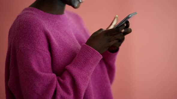 Positive woman volunteer showing Korean heart shape gesture at the camera alt