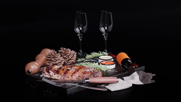 Festive table on a dark background: steak and glasses alt