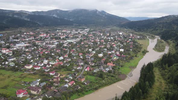 Village in the Carpathian Mountains in Autumn. Slow Motion, Aerial View alt