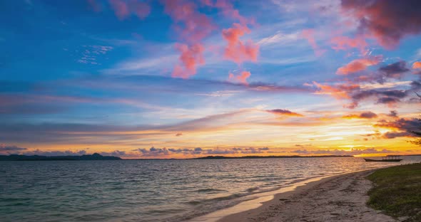 Time lapse: sunset colorful sky on sea, tropical desert beach, no