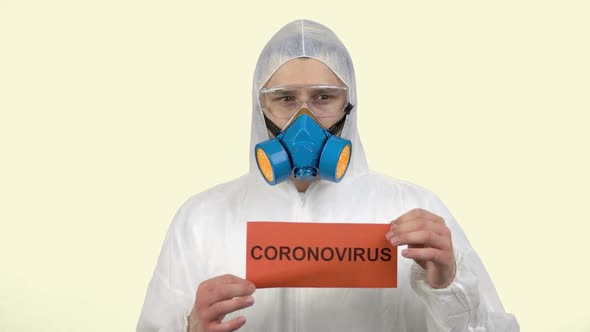 Portrait of Scared Man Wearing Respiratiory Mask and Protective Clothing alt