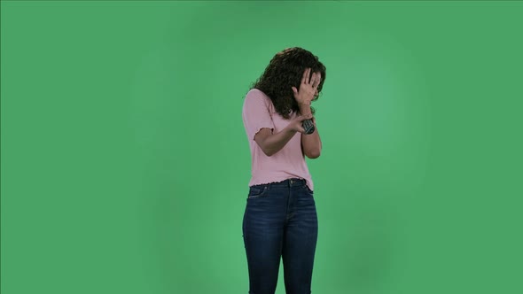 Portrait of Beautiful African American Young Shocked Woman with TV Remote in Her Hand, Switching on alt