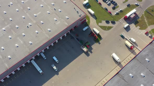 Distribution logistics buildings and industrial area - aerial view alt