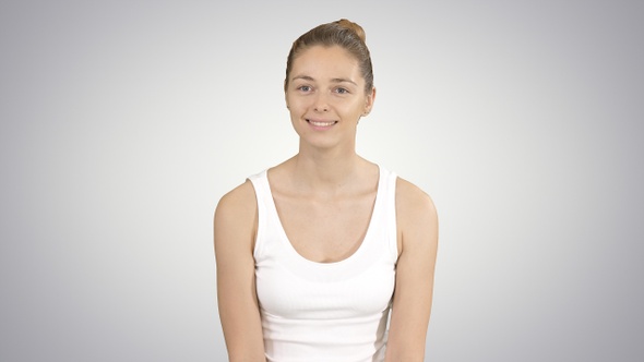 Smiling girl resting after yoga training and talking to alt