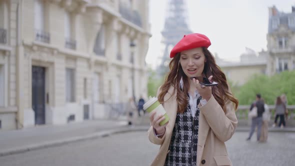 Beautiful young woman spending time in Paris. alt