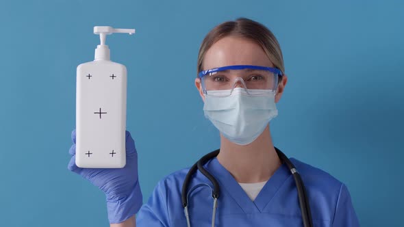 Nurse showing white bottle for disinfectant with tracking markers. Healthcare concept