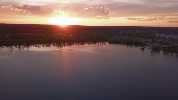 Beautiful Sunset with Clouds Over the River Under Construction Houses in the Dark Ukraine Kiev on