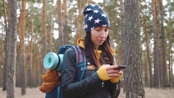 Young Woman Hiking Nature in Pine Forest alt