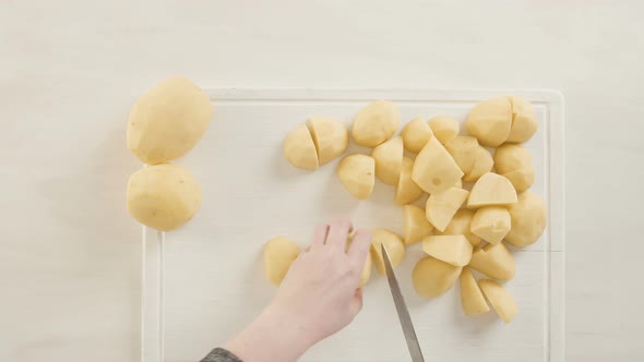 Step by step. Slicing Yukon gold potatoes for classic mashed potatoes. alt