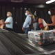 Tourists and Travelers Wait for Arrival of Checked Bags Suitcases at Terminal - VideoHive Item for Sale