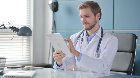 Doctor Working on Tablet in Clinic alt