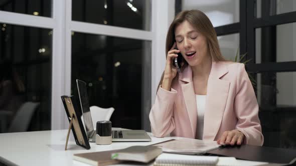 Confident Businesswoman Talking Smartphone in Office Interior